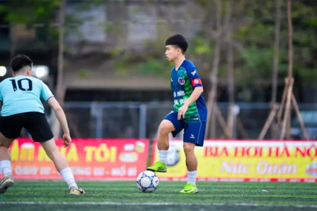 Dynamic capture of a football match between young players in Hà Nội, Vietnam.