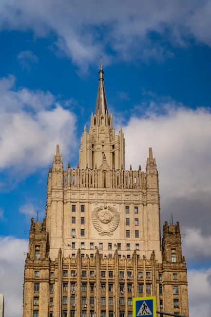 Statuesque view of the Ministry of Foreign Affairs building under a blue sky in Moscow, Russia.